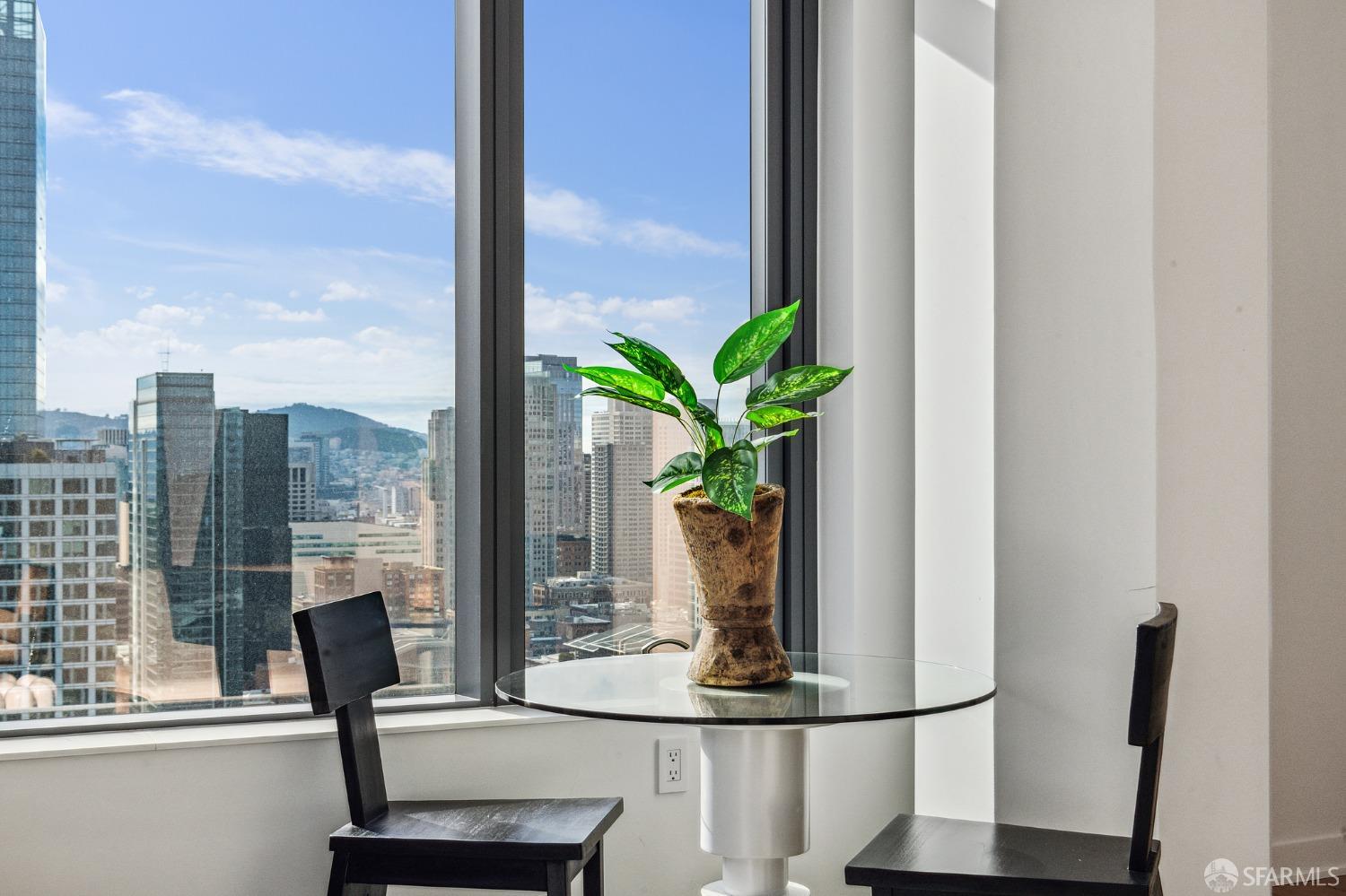 280 Spear Street, Unit 34C San Francisco, CA 94105 - Photo 8 of 47 a vase of flowers sitting next to a window