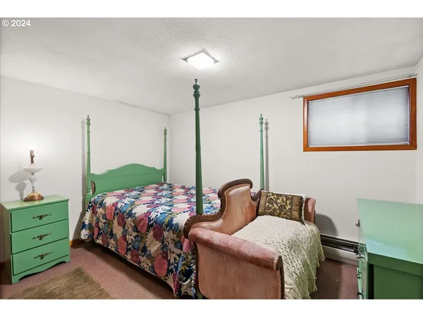 a bedroom with bed and window