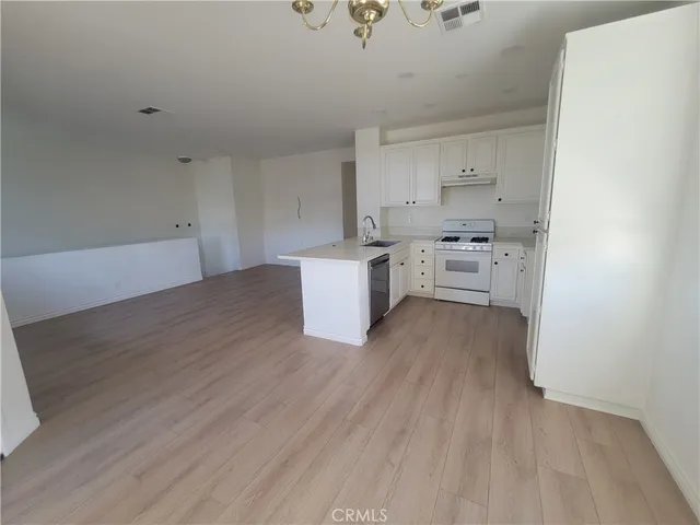 a room with cabinets and wooden floor