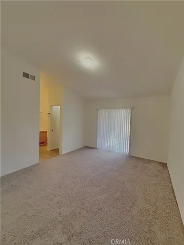 a spacious bathroom with a double vanity sink a mirror and a bathtub