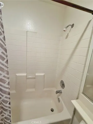 a view of a room with wooden walls