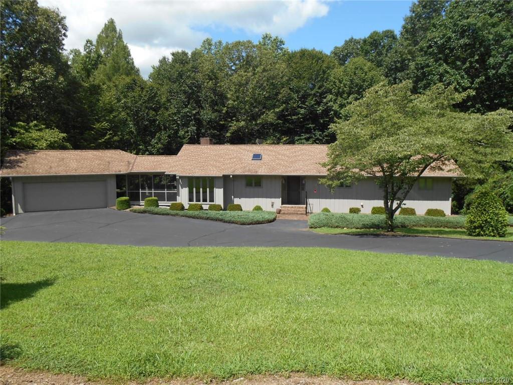 724 Laurel Ridge Road Columbus, NC 28722 - Photo 15 of 15 a view of a house with pool and a yard