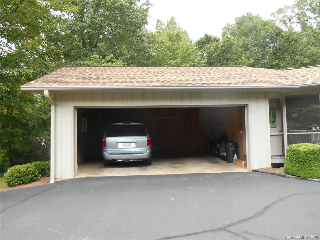 724 Laurel Ridge Road Columbus, NC 28722 - Photo 3 of 15 a view of garage with a car parked in front of it