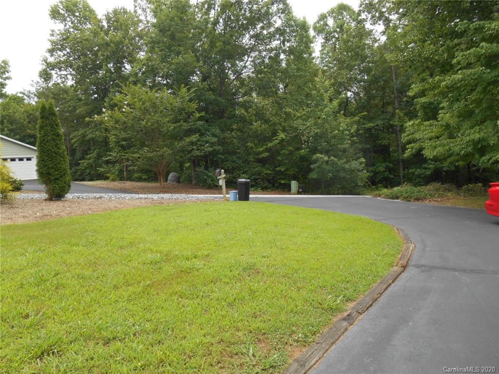 724 Laurel Ridge Road Columbus, NC 28722 - Photo 6 of 15 a view of yard with swimming pool and seating space