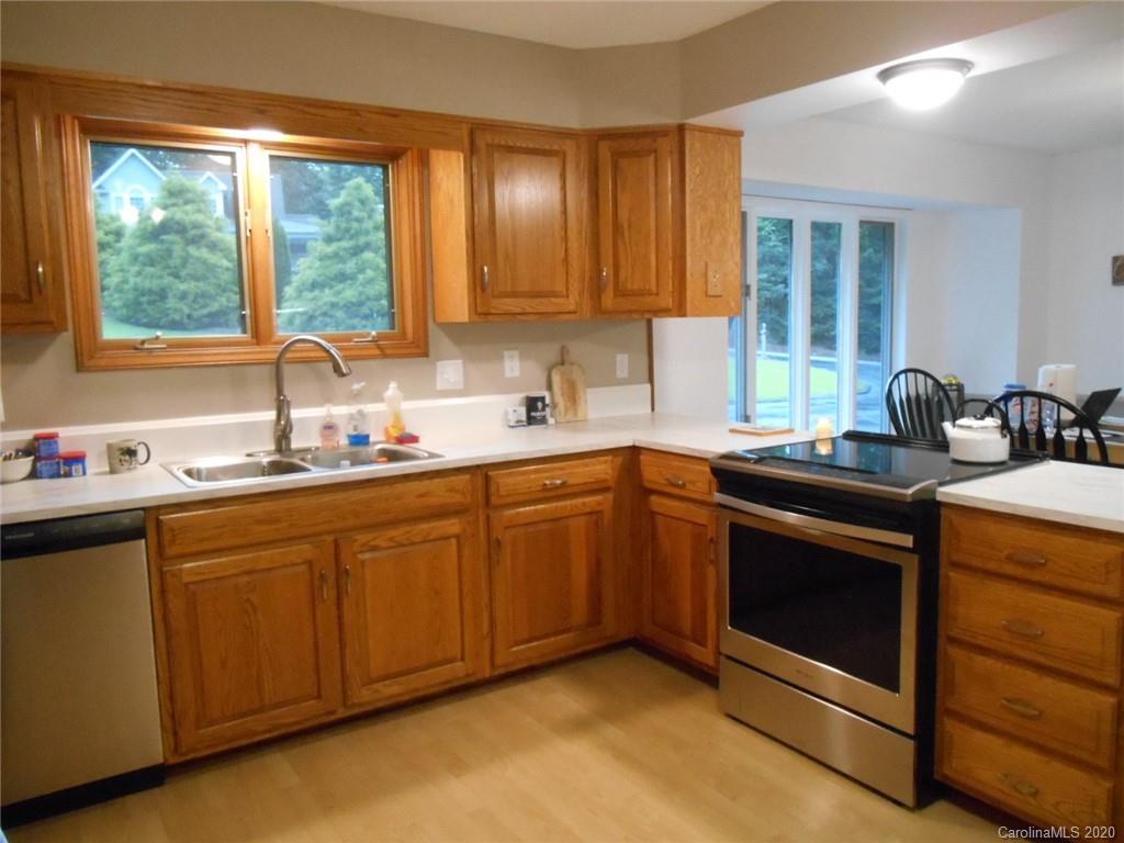 724 Laurel Ridge Road Columbus, NC 28722 - Photo 7 of 15 a kitchen with sink cabinets and window