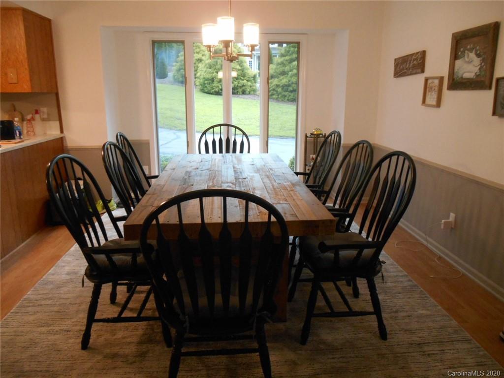 724 Laurel Ridge Road Columbus, NC 28722 - Photo 10 of 15 a view of a dining room with furniture window and outside view