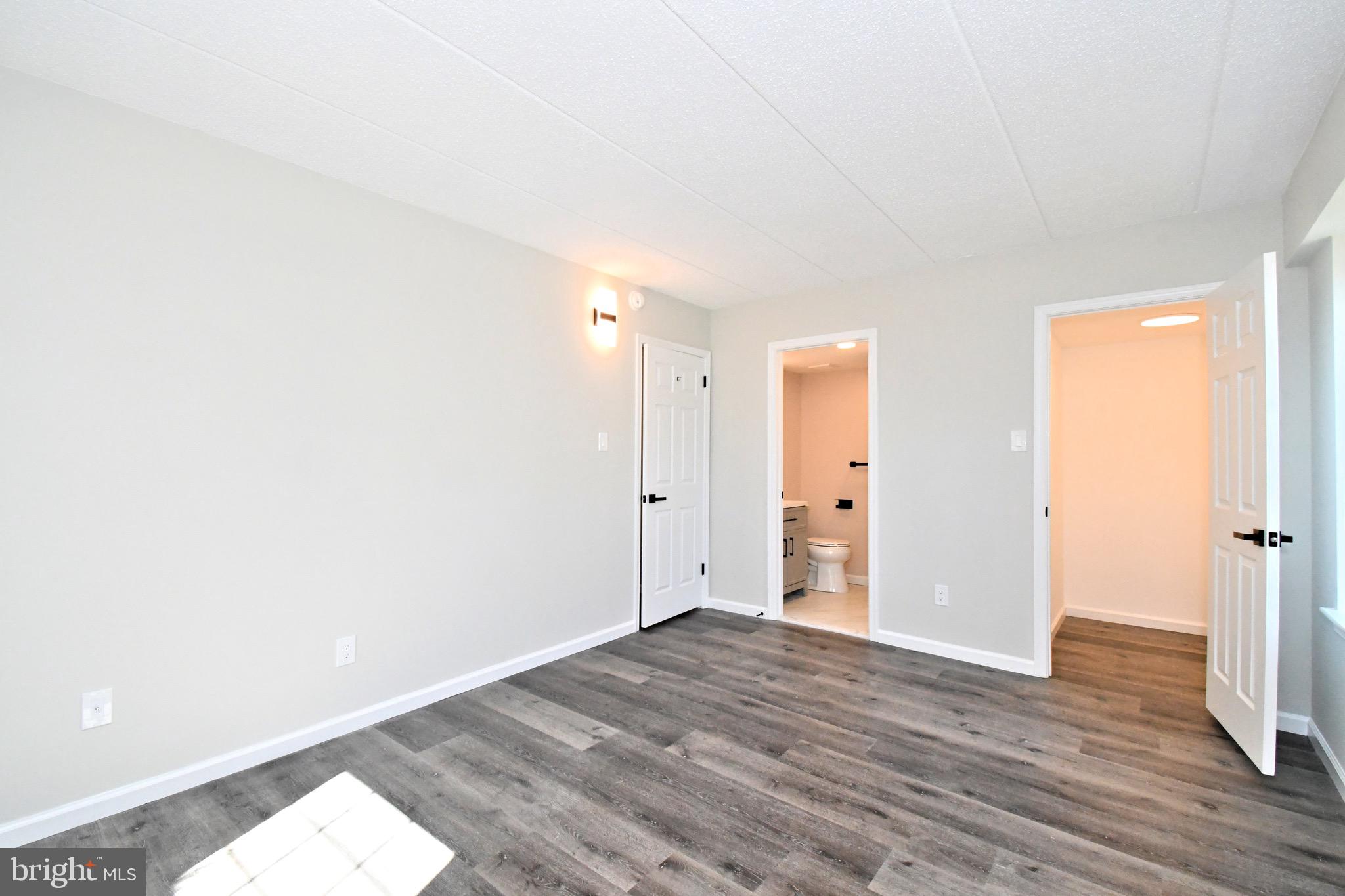 613 Washington Place, Unit 13 Chesterbrook, PA 19087 - Photo 23 of 64 a view of an empty room and wooden floor