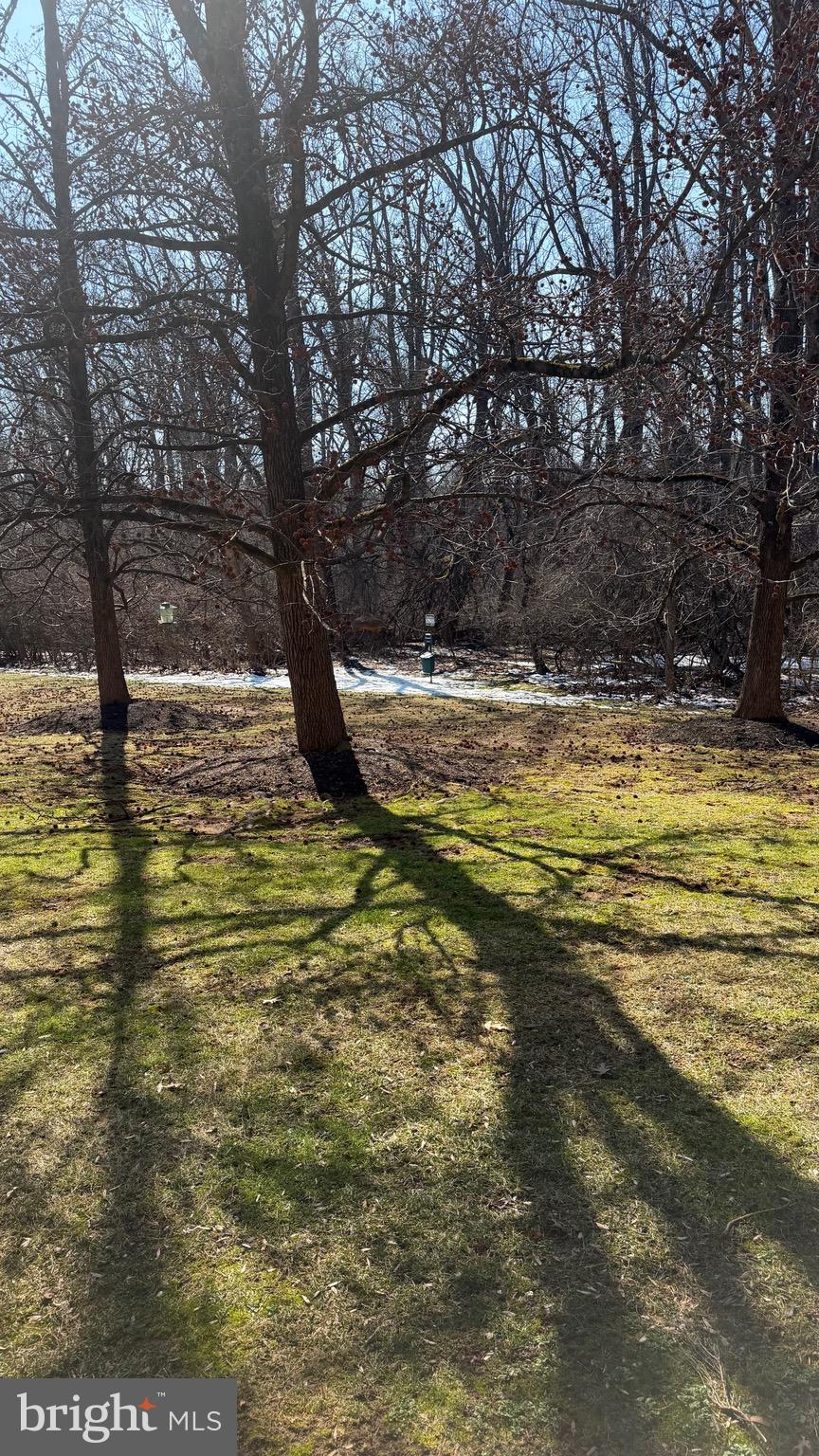 613 Washington Place, Unit 13 Chesterbrook, PA 19087 - Photo 52 of 64 a view of a swimming pool with an outdoor space and seating area