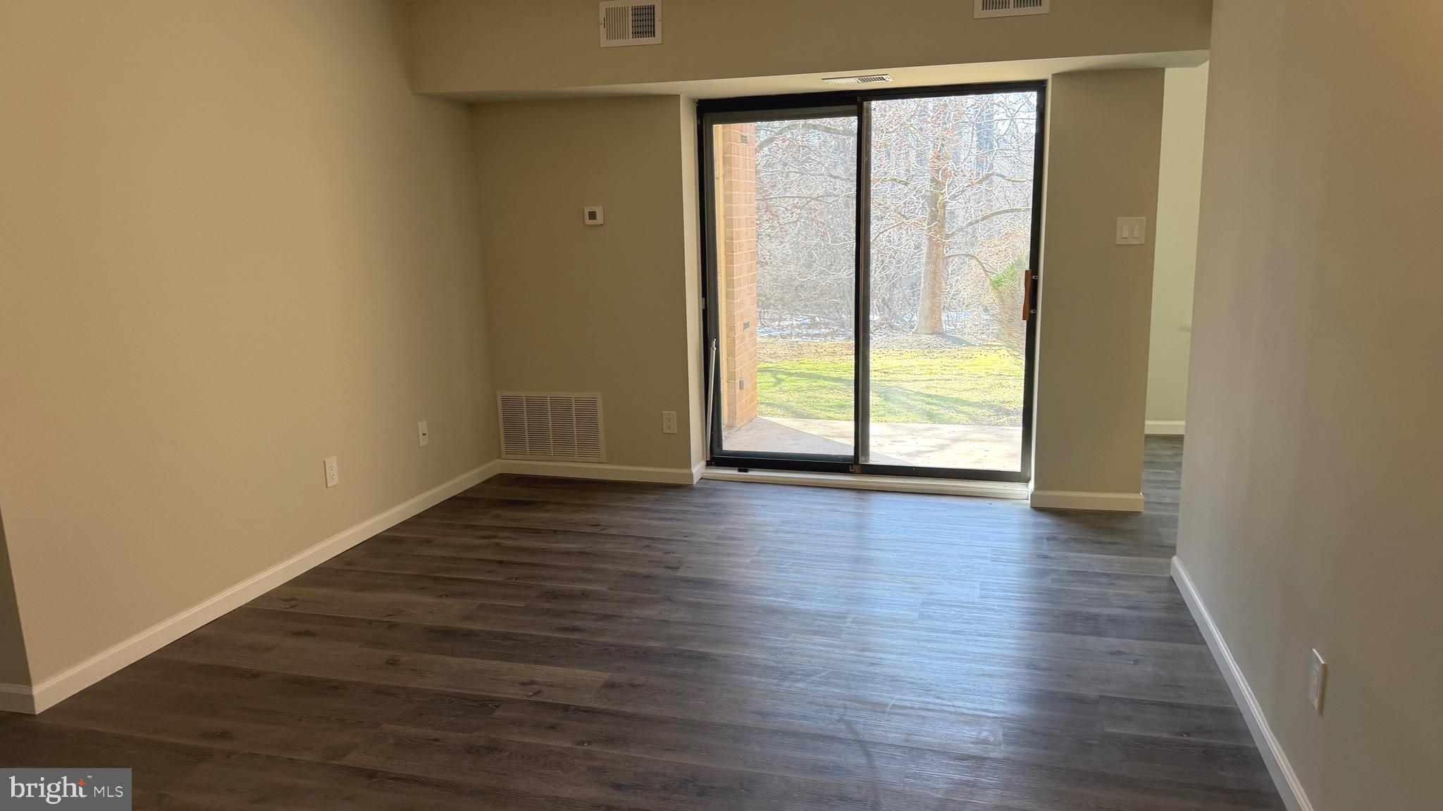 613 Washington Place, Unit 13 Chesterbrook, PA 19087 - Photo 54 of 64 a view of a big room with wooden floor and windows