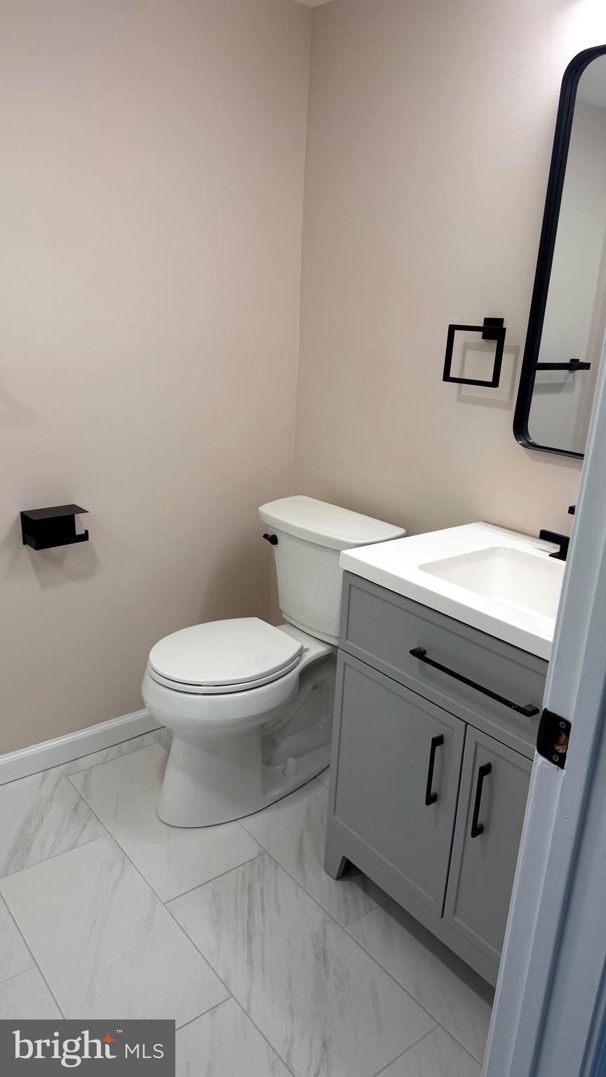 613 Washington Place, Unit 13 Chesterbrook, PA 19087 - Photo 56 of 64 a white toilet sitting next to a white sink