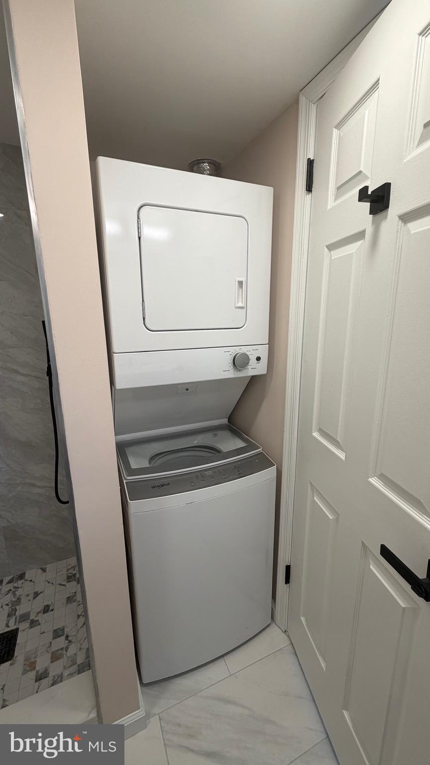 613 Washington Place, Unit 13 Chesterbrook, PA 19087 - Photo 58 of 64 a utility room with dryer and washer