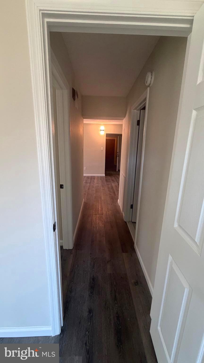 613 Washington Place, Unit 13 Chesterbrook, PA 19087 - Photo 59 of 64 a view of a hallway with wooden floor