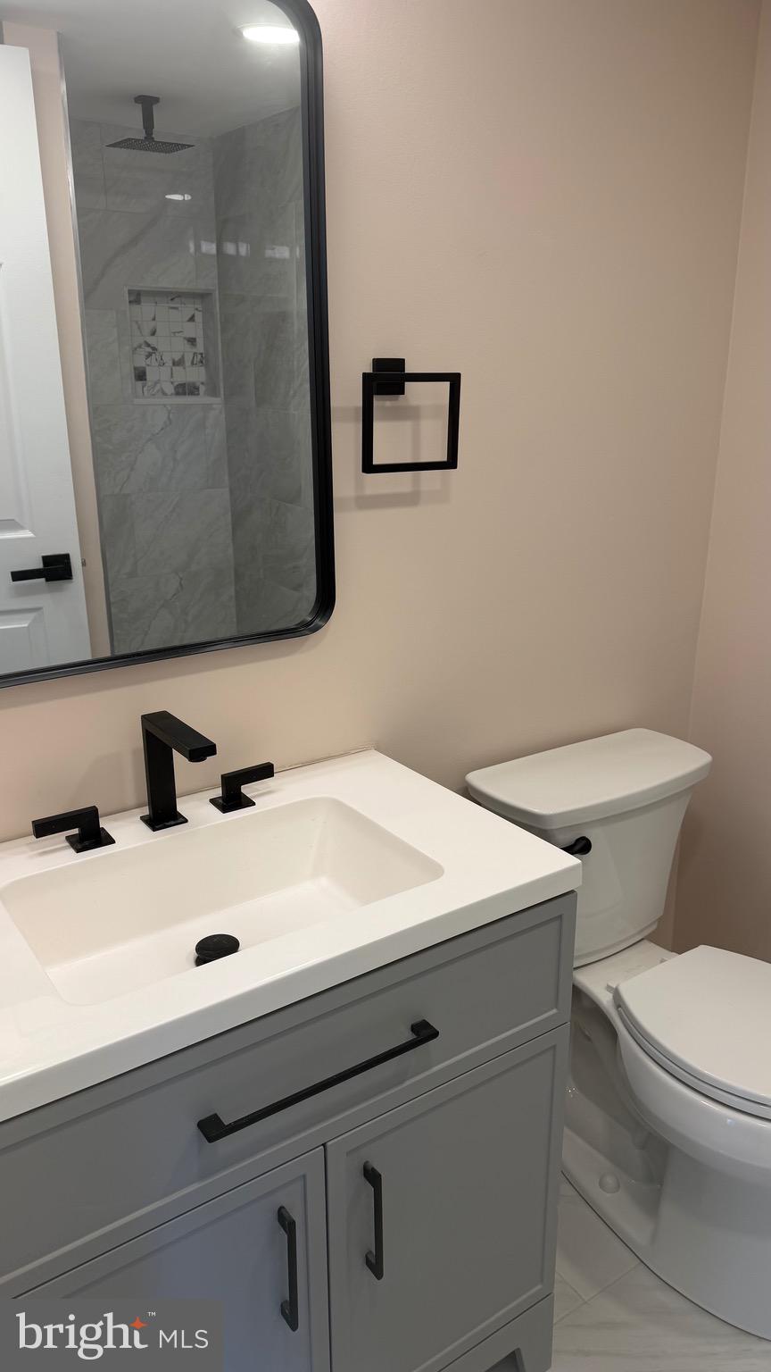 613 Washington Place, Unit 13 Chesterbrook, PA 19087 - Photo 63 of 64 a bathroom with a sink and a toilet