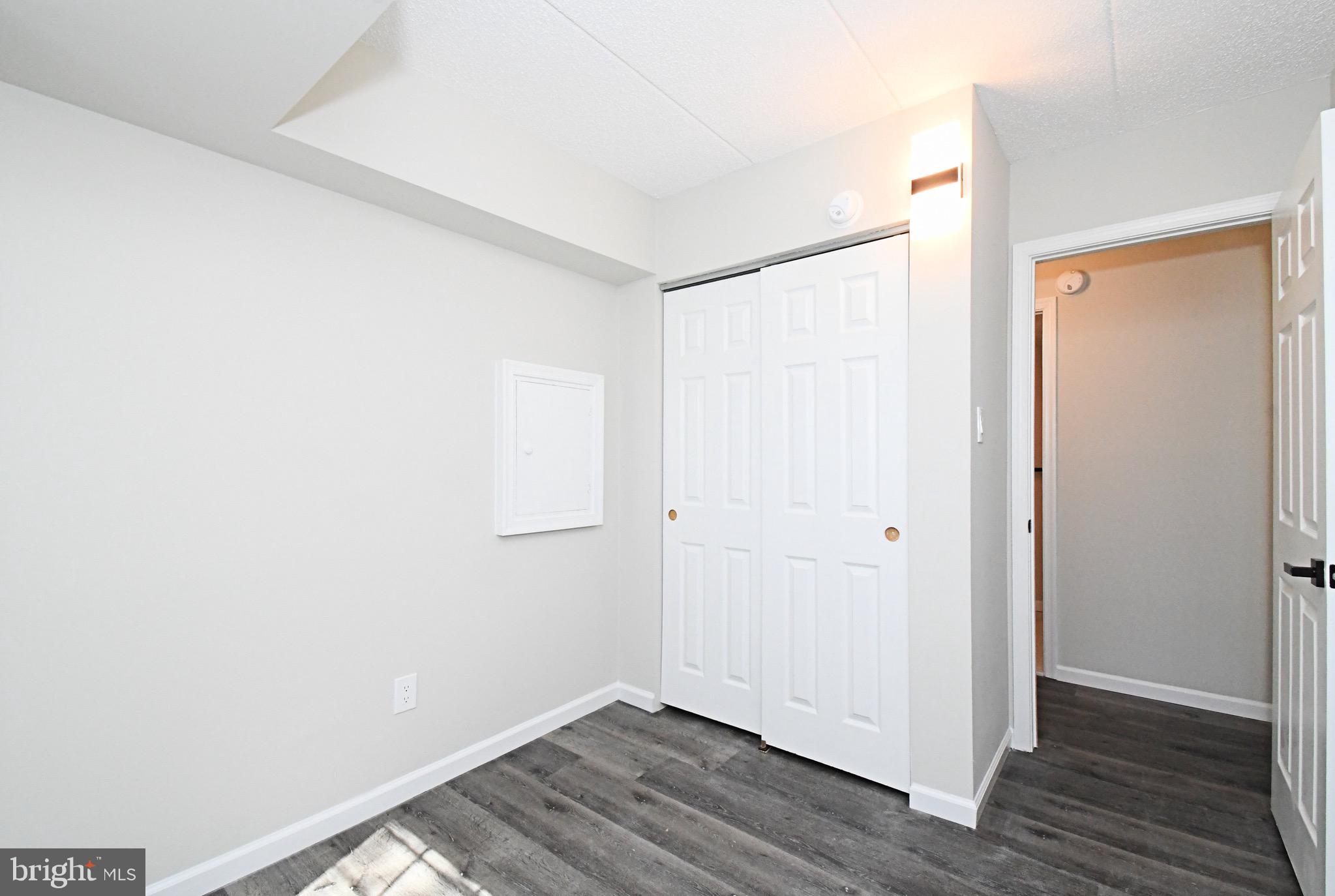 613 Washington Place, Unit 13 Chesterbrook, PA 19087 - Photo 9 of 64 a view of an empty room with wooden floor