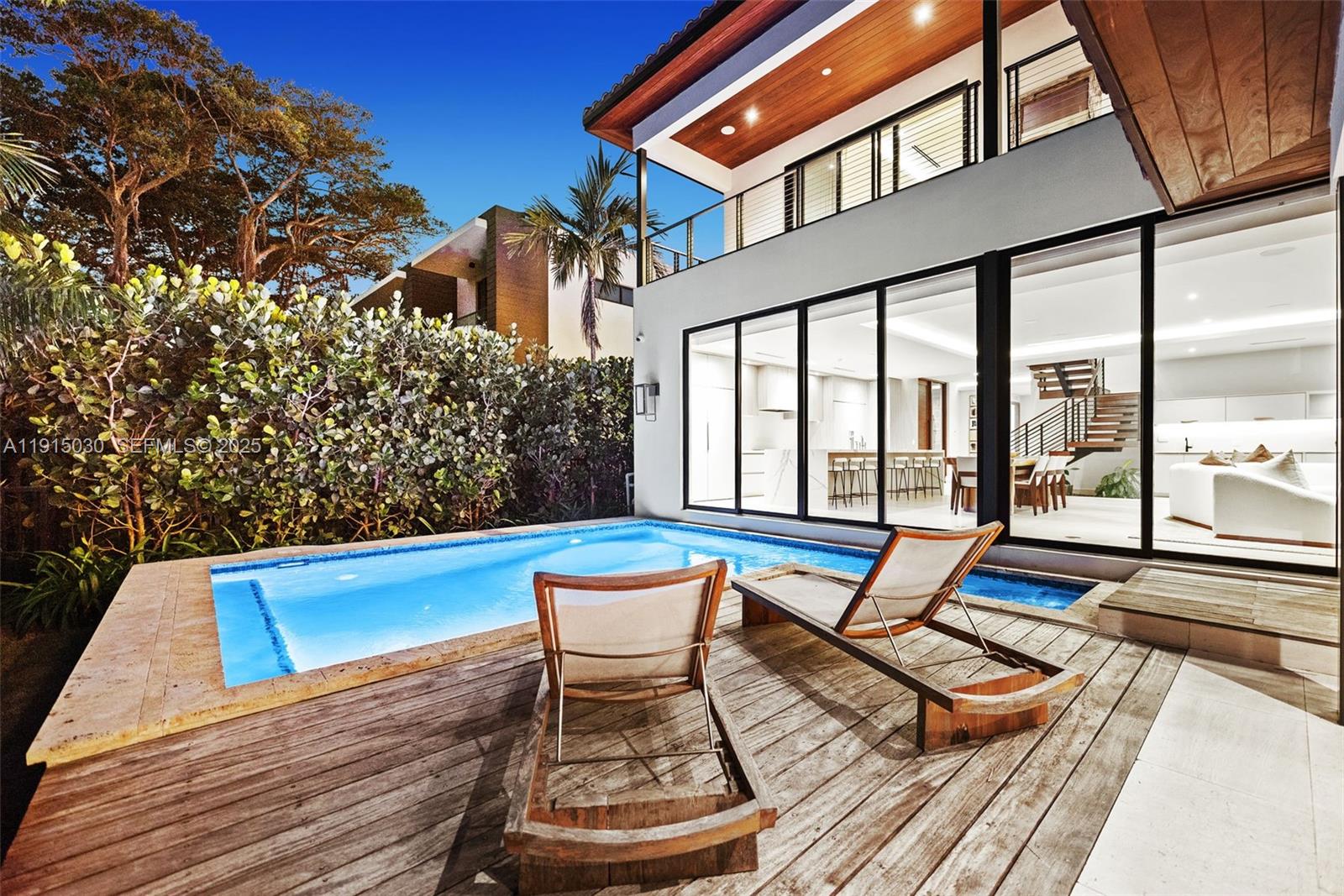 5831 Alton Road Miami Beach, FL 33140 - Photo 14 of 48 a view of sitting area with furniture and wooden floor