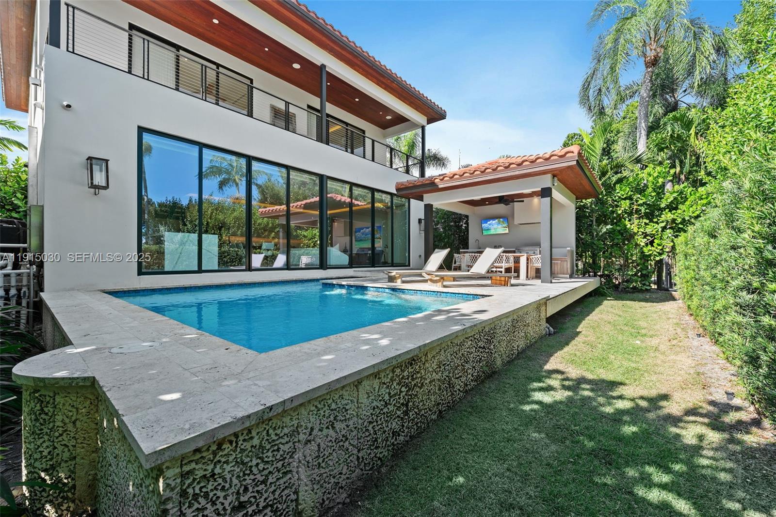 5831 Alton Road Miami Beach, FL 33140 - Photo 15 of 48 a view of a house with a swimming pool