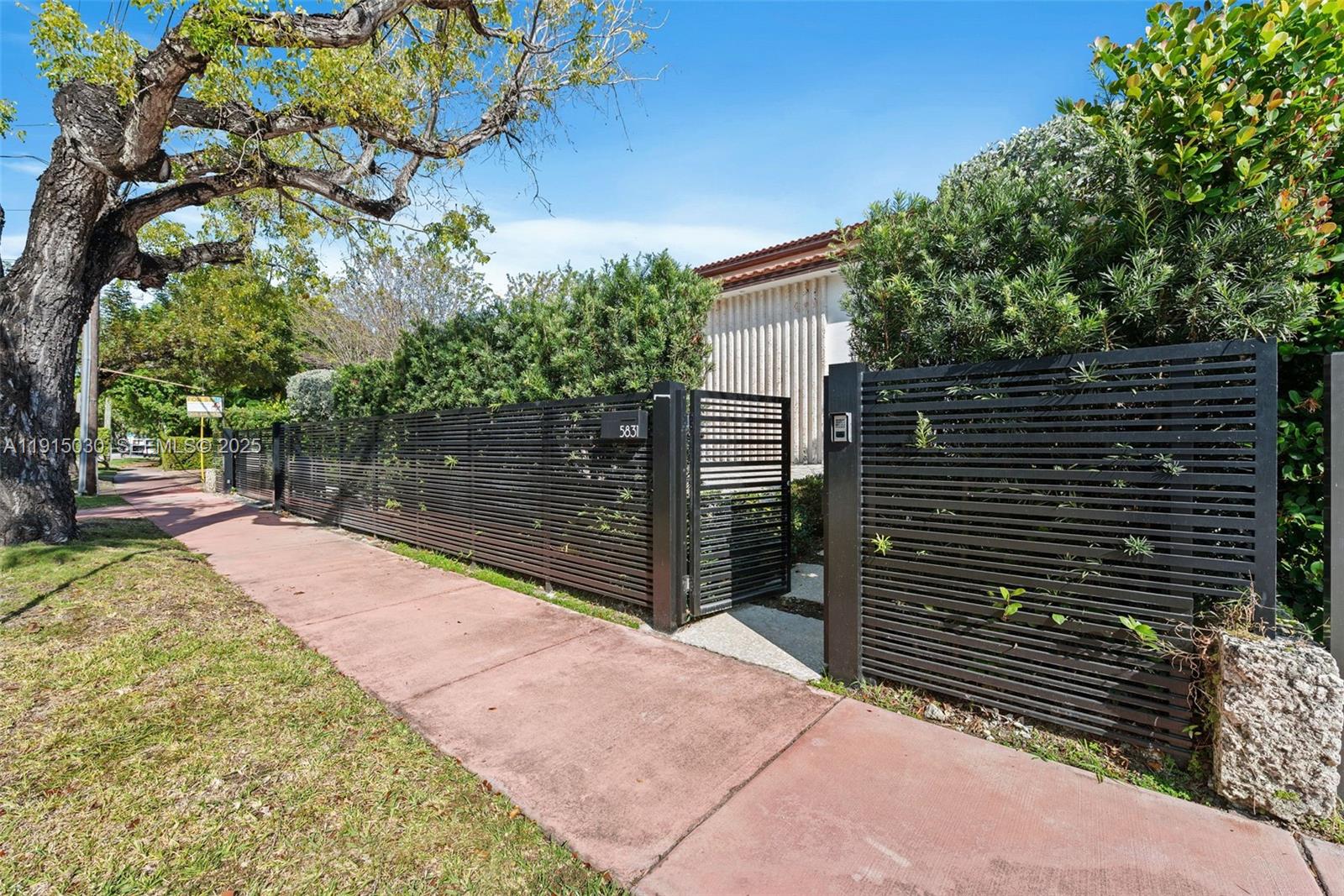 5831 Alton Road Miami Beach, FL 33140 - Photo 3 of 48 a backyard of a house with lots of green space