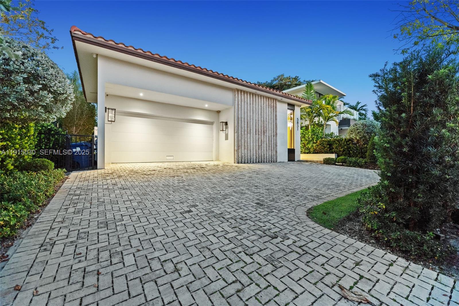5831 Alton Road Miami Beach, FL 33140 - Photo 8 of 48 a front view of a house with a yard