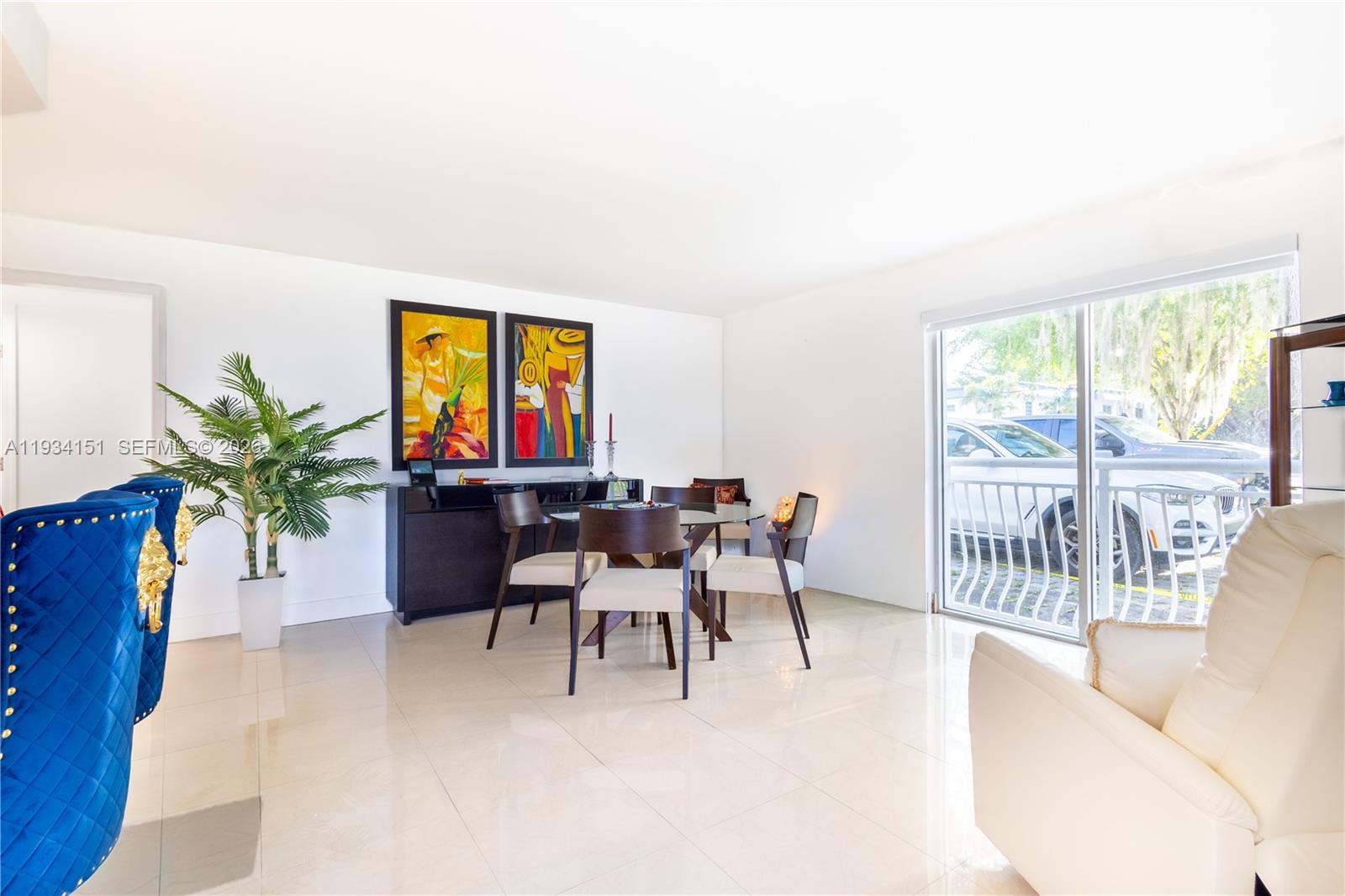 3101 Southwest 27th Avenue, Unit 101 Miami, FL 33133 - Photo 11 of 11 a living room with furniture and a large window