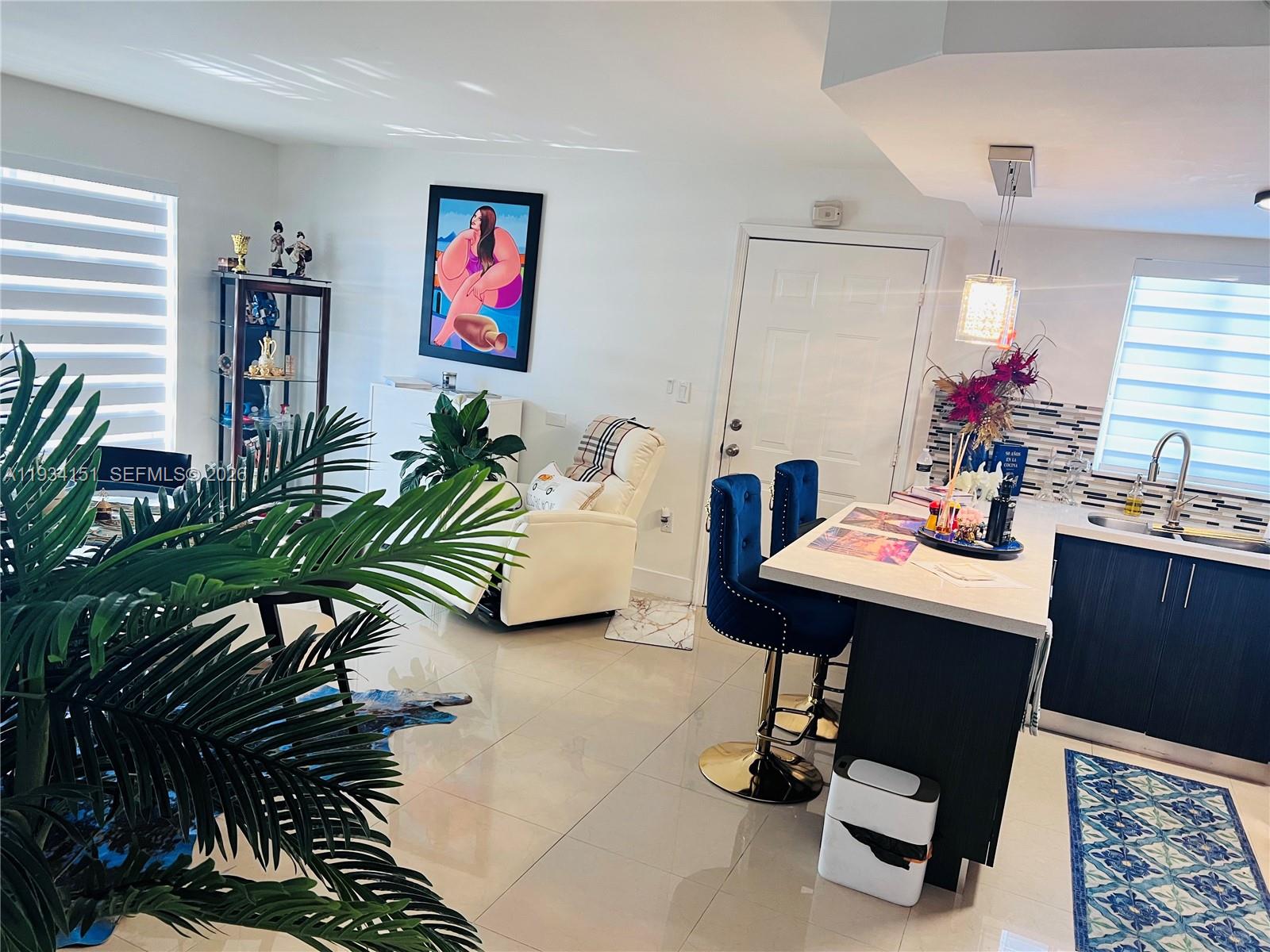 3101 Southwest 27th Avenue, Unit 101 Miami, FL 33133 - Photo 2 of 11 a view of a workspace with furniture