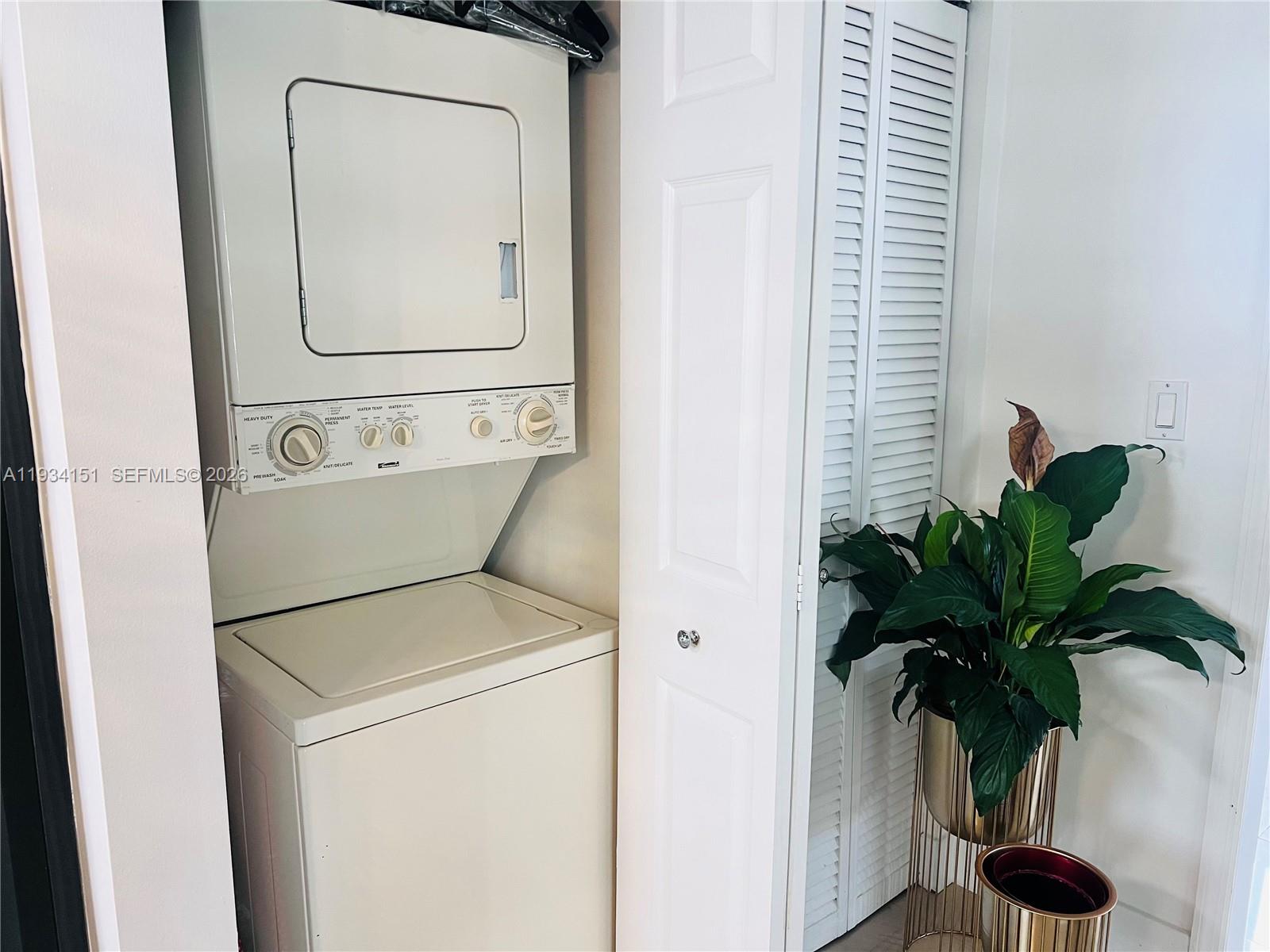 3101 Southwest 27th Avenue, Unit 101 Miami, FL 33133 - Photo 4 of 11 a close view of a utility room with a washer and dryer