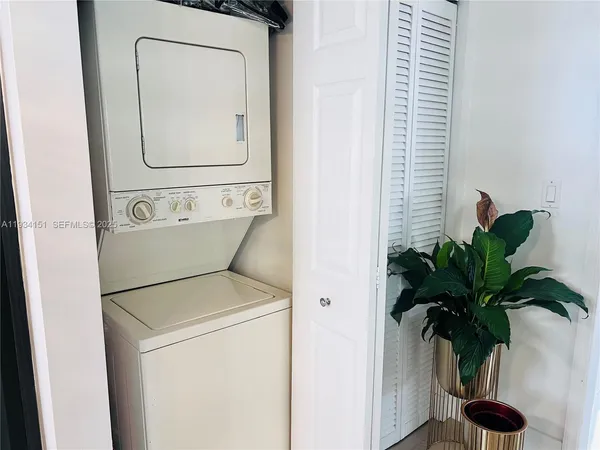 a close view of a utility room with a washer and dryer