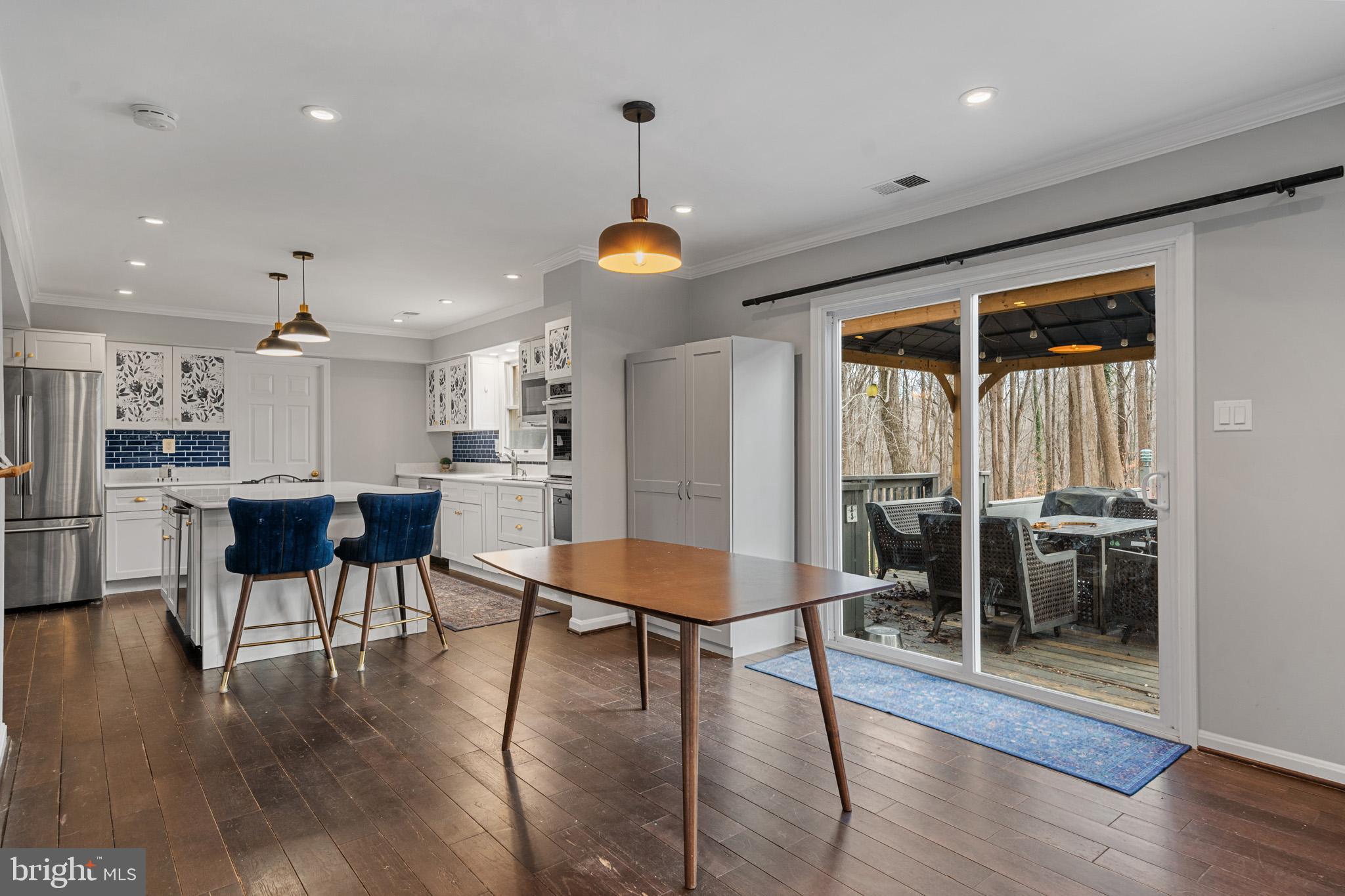 5918 Old Croom Station Road Upper Marlboro, MD 20772 - Photo 15 of 89 a view of a dining room with furniture and wooden floor