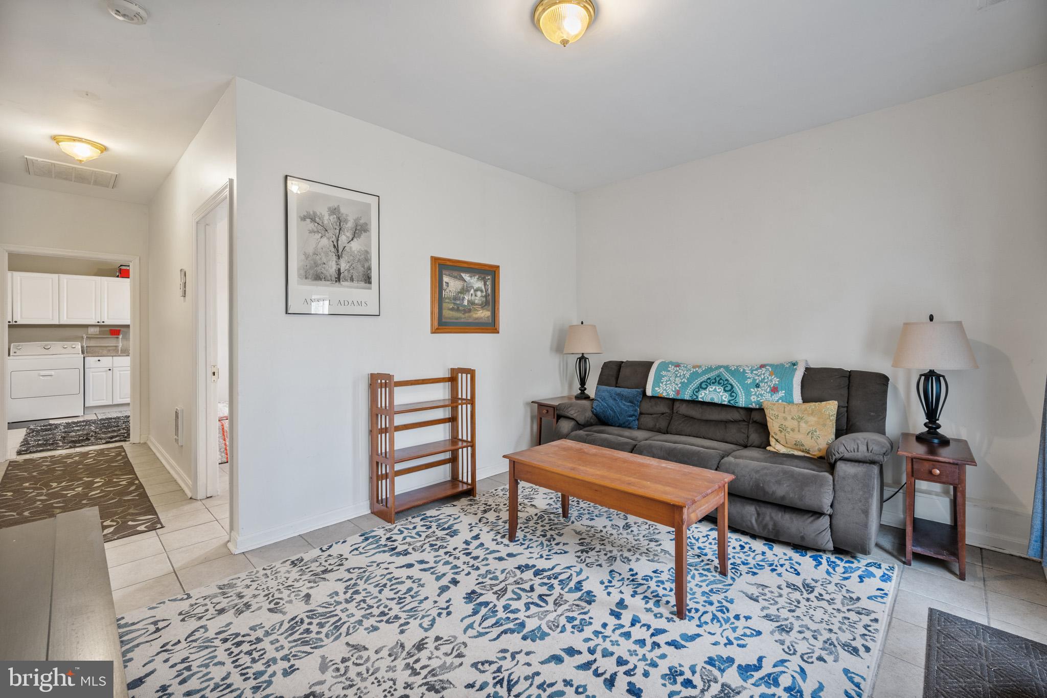 5918 Old Croom Station Road Upper Marlboro, MD 20772 - Photo 56 of 89 a living room with furniture and wooden floor