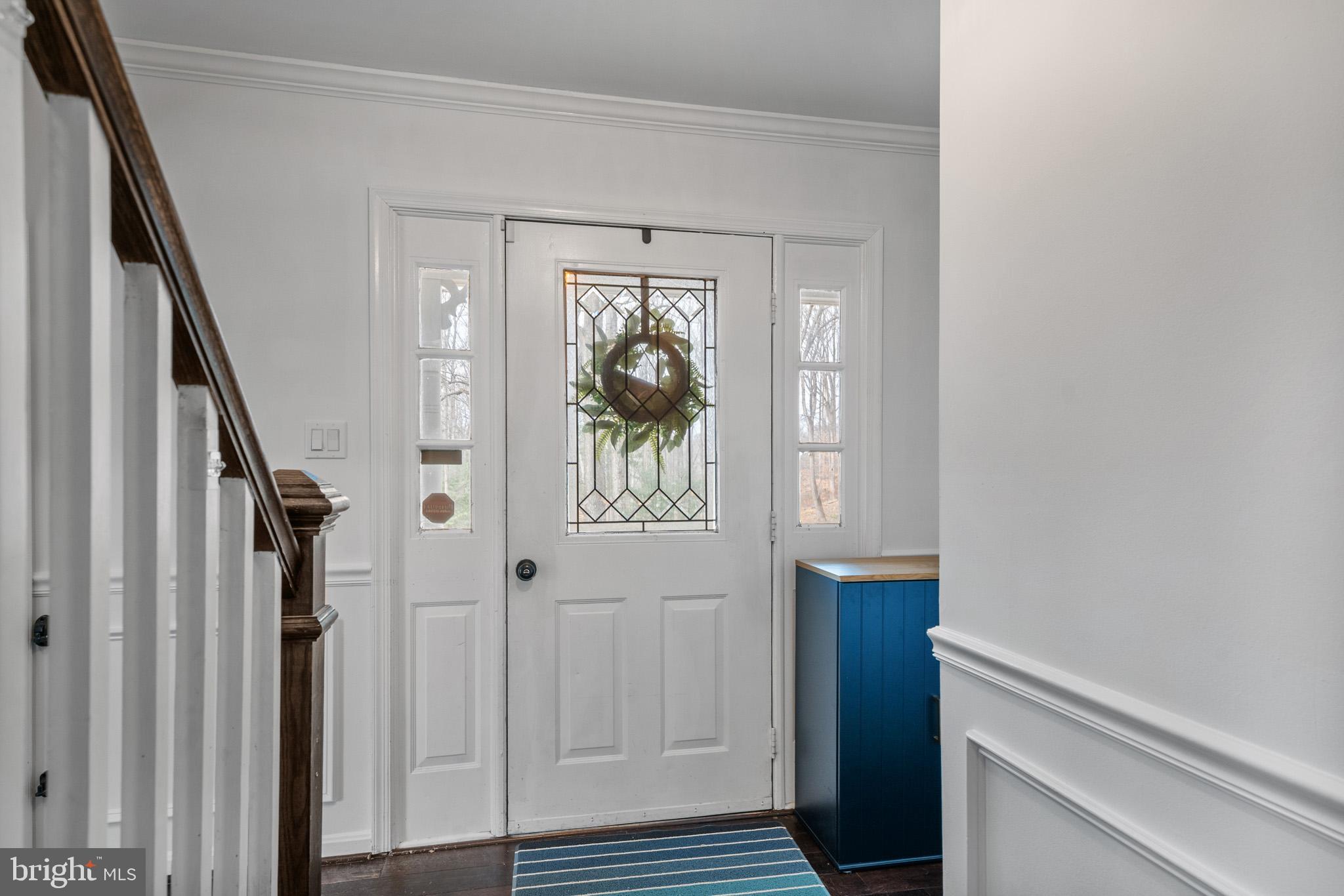5918 Old Croom Station Road Upper Marlboro, MD 20772 - Photo 6 of 89 a view of hallway with wooden floor and stairs