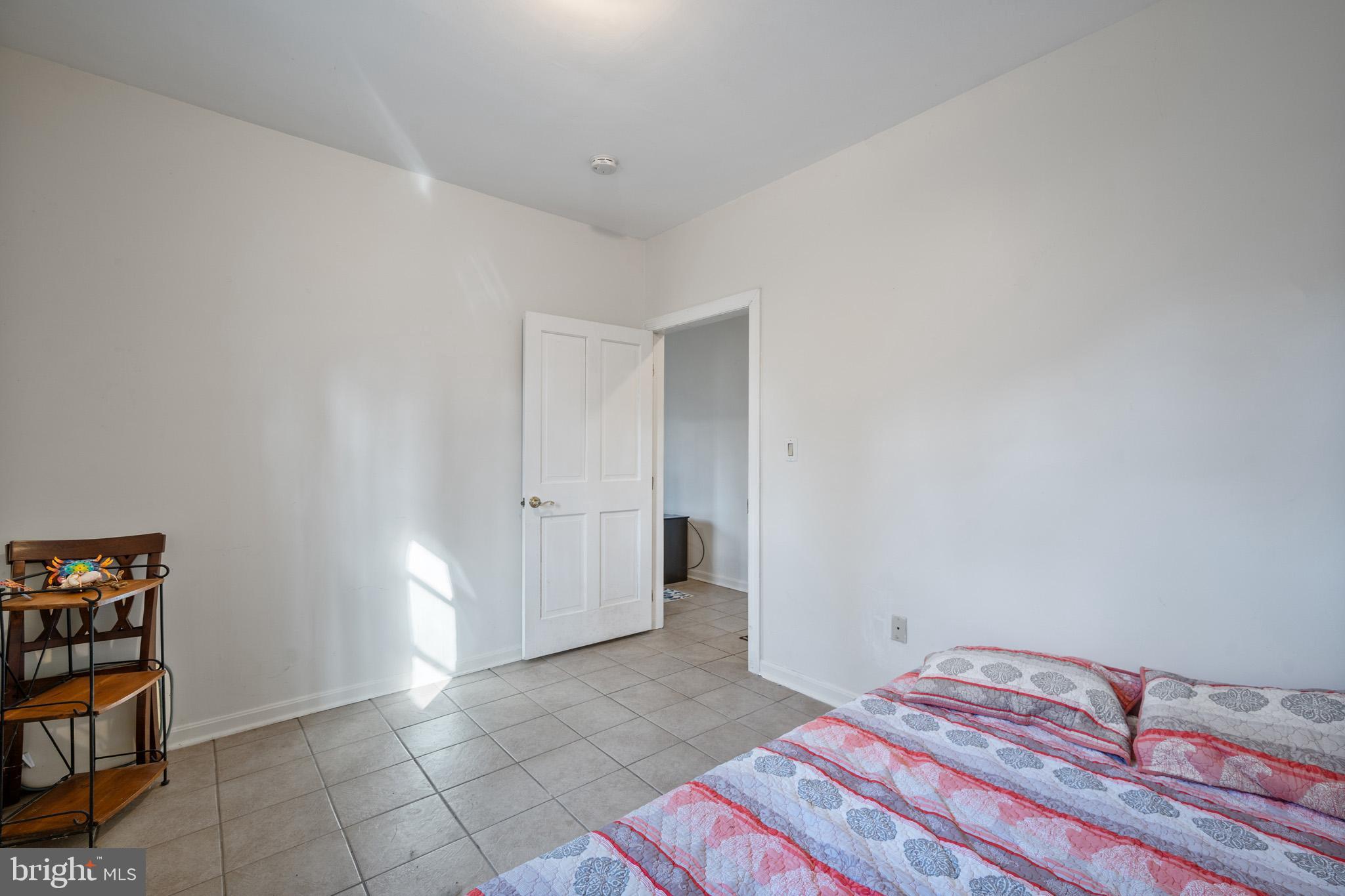 5918 Old Croom Station Road Upper Marlboro, MD 20772 - Photo 60 of 89 a bedroom with a bed and a book shelf