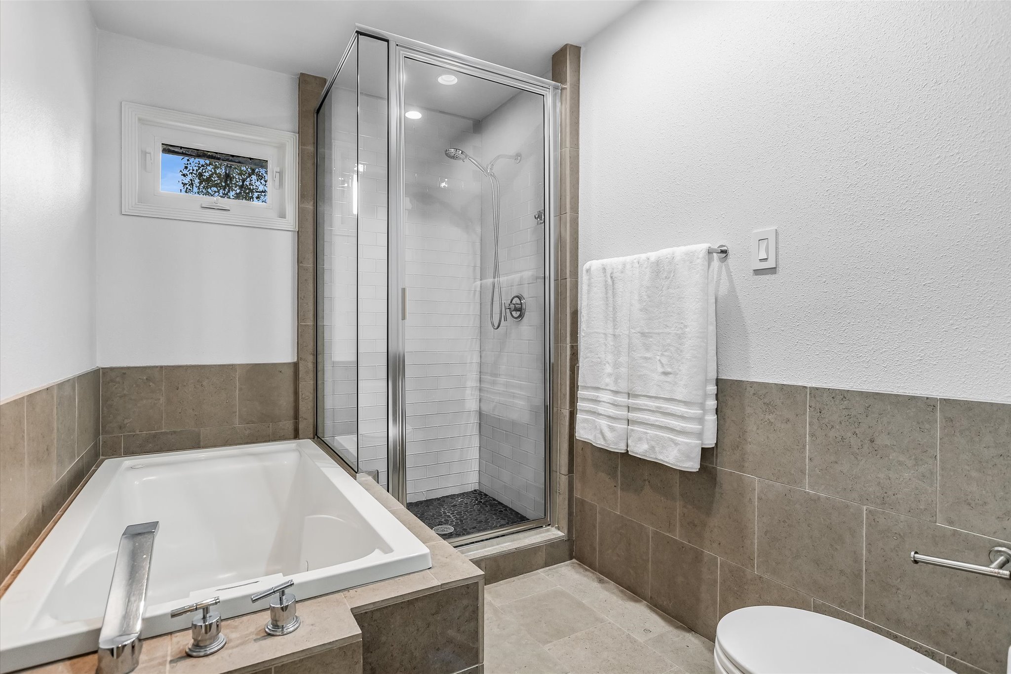 5622 Parade Ridge Austin, TX 78731 - Photo 17 of 24 Full bath featuring a bath and separate shower