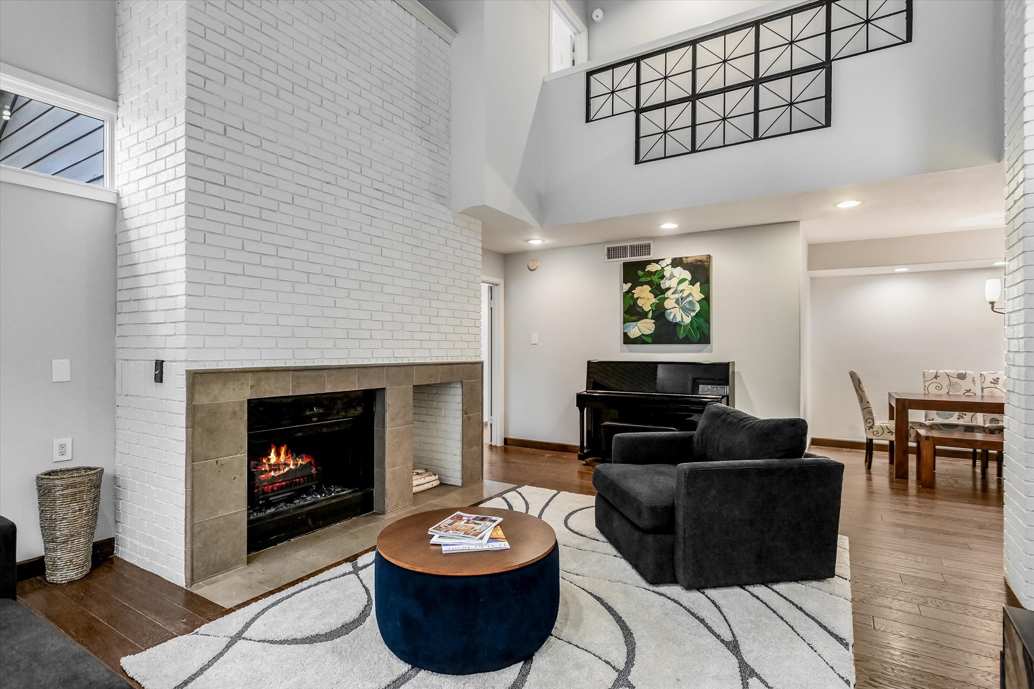 5622 Parade Ridge Austin, TX 78731 - Photo 6 of 24 Living area with a fireplace and a high ceiling