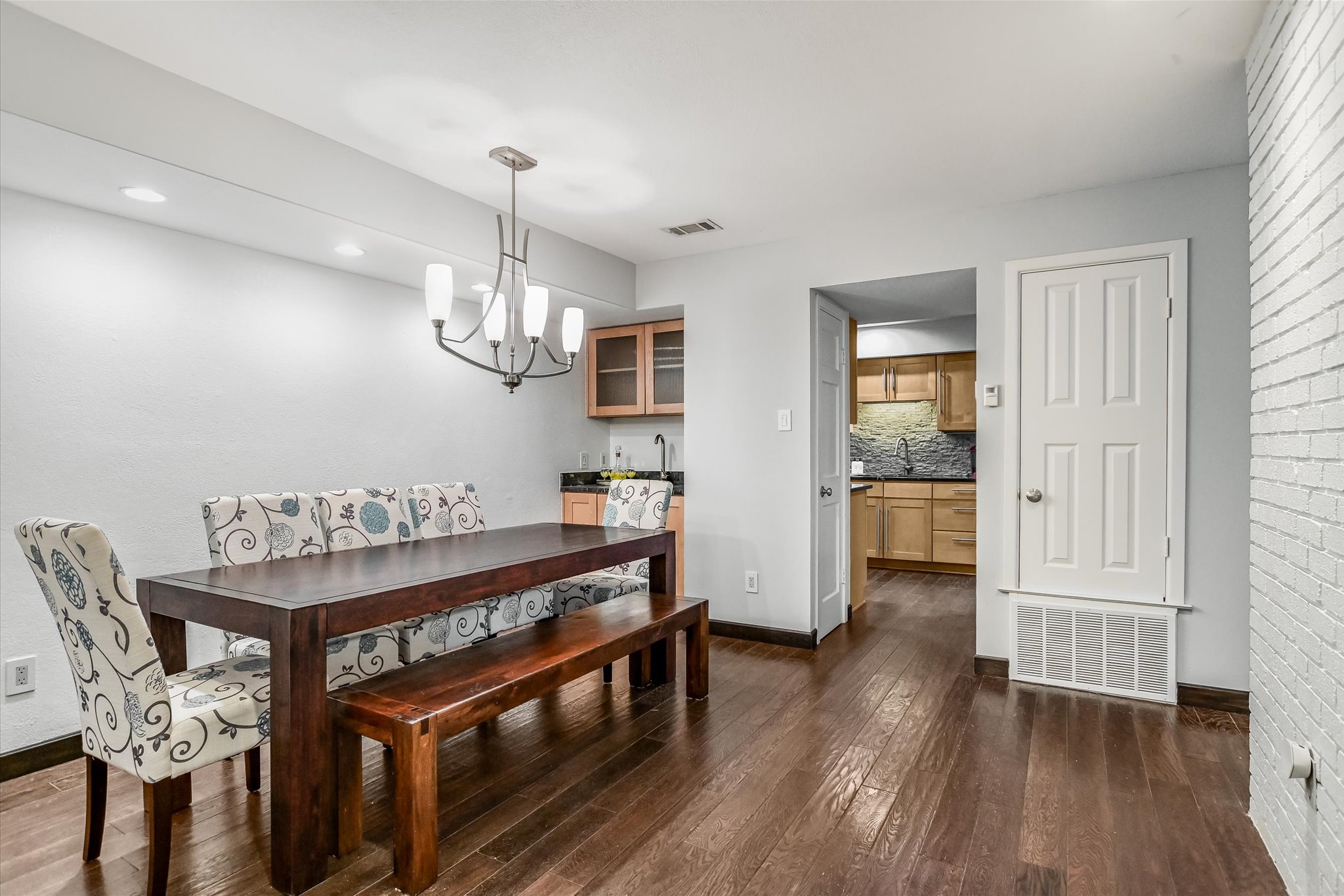 5622 Parade Ridge Austin, TX 78731 - Photo 8 of 24 Dining room with chandelier and wet bar
