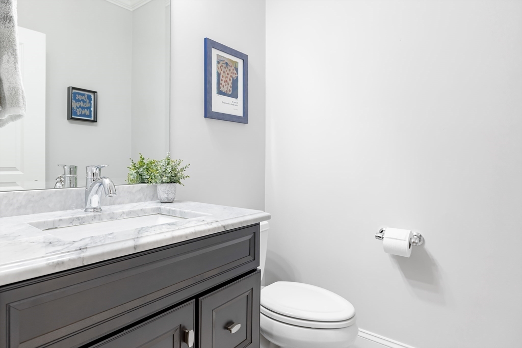 1332 Great Plain Avenue Needham, MA 02492 - Photo 14 of 42 a bathroom with a granite countertop sink and a mirror