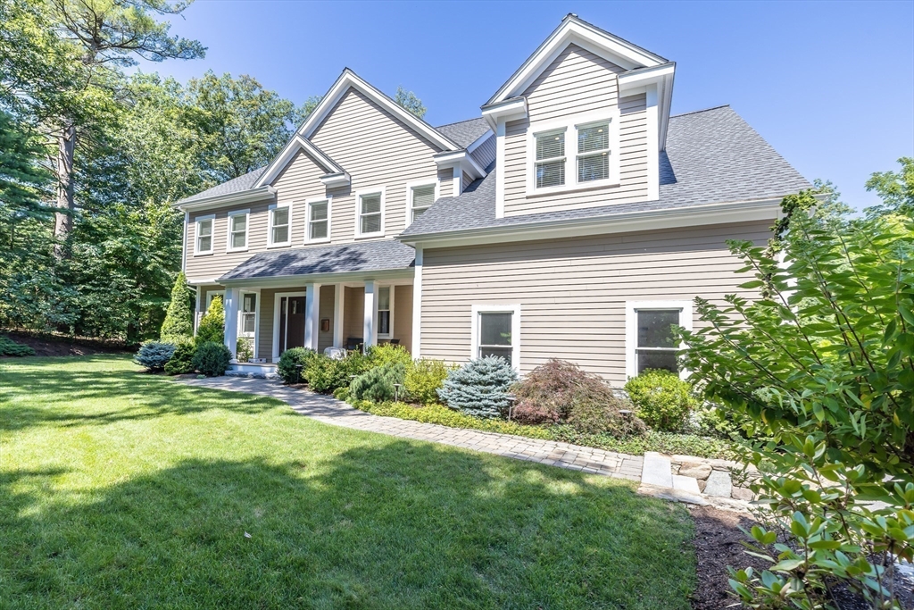 1332 Great Plain Avenue Needham, MA 02492 - Photo 37 of 42 a front view of a house with a yard and trees