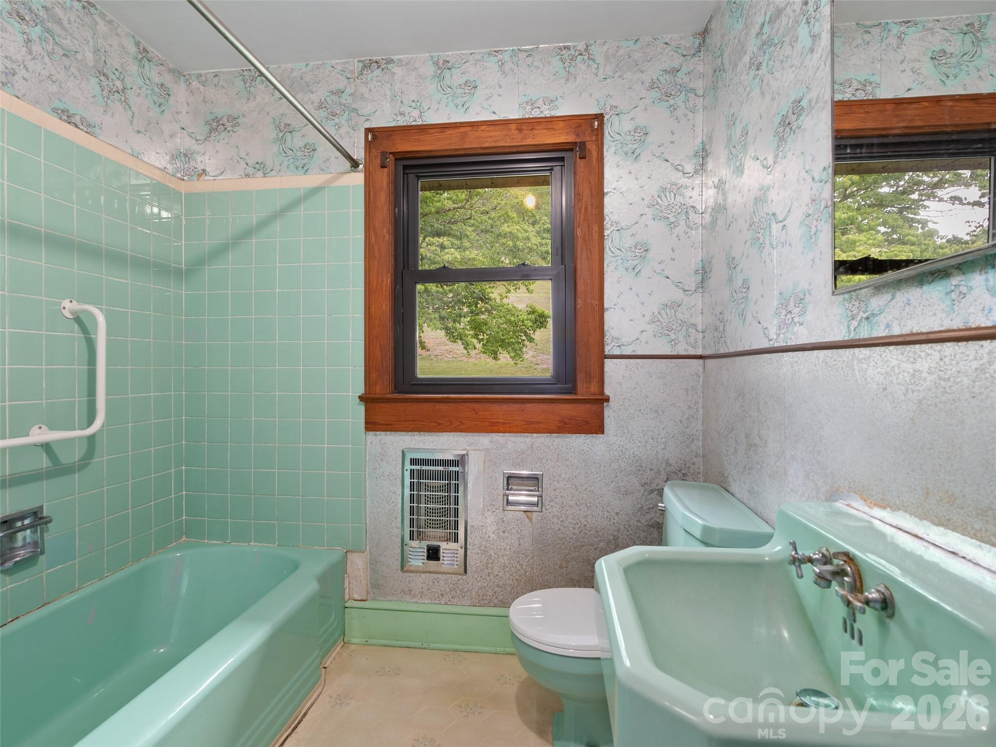21 Beaverdam Road Canton, NC 28716 - Photo 17 of 24 a bath room with a toilet and a bath tub