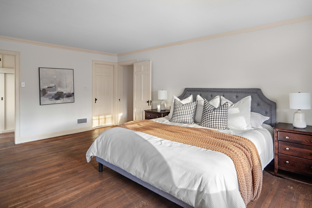 5 Evelyn Road Newton, MA 02468 - Photo 13 of 21 a bedroom with bed and painting on the wall