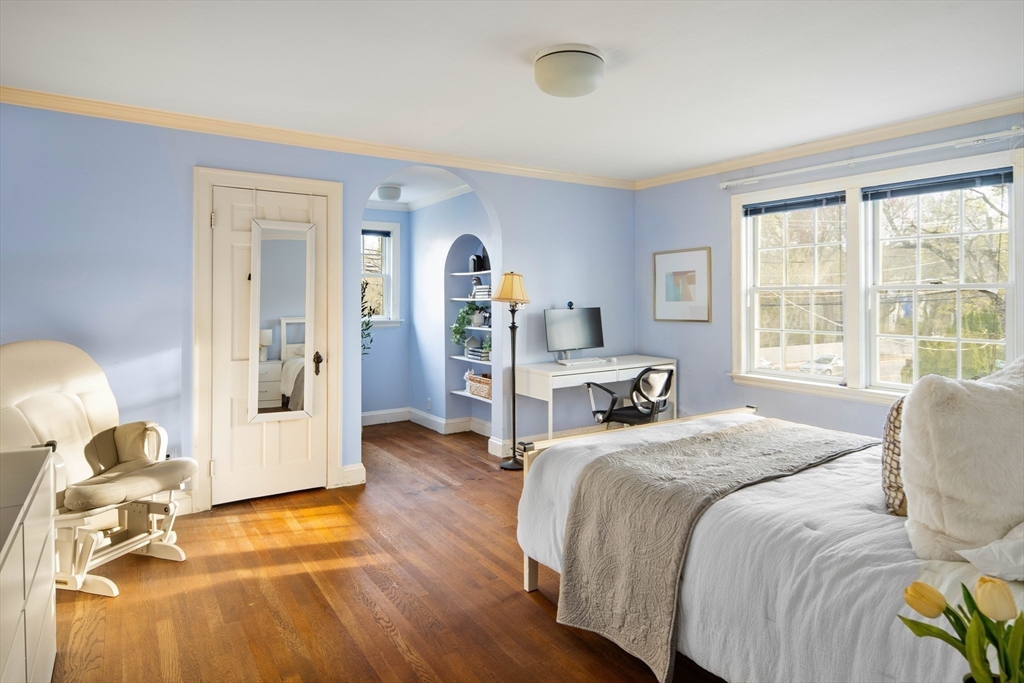 5 Evelyn Road Newton, MA 02468 - Photo 14 of 21 a bedroom with a bed and wooden floor