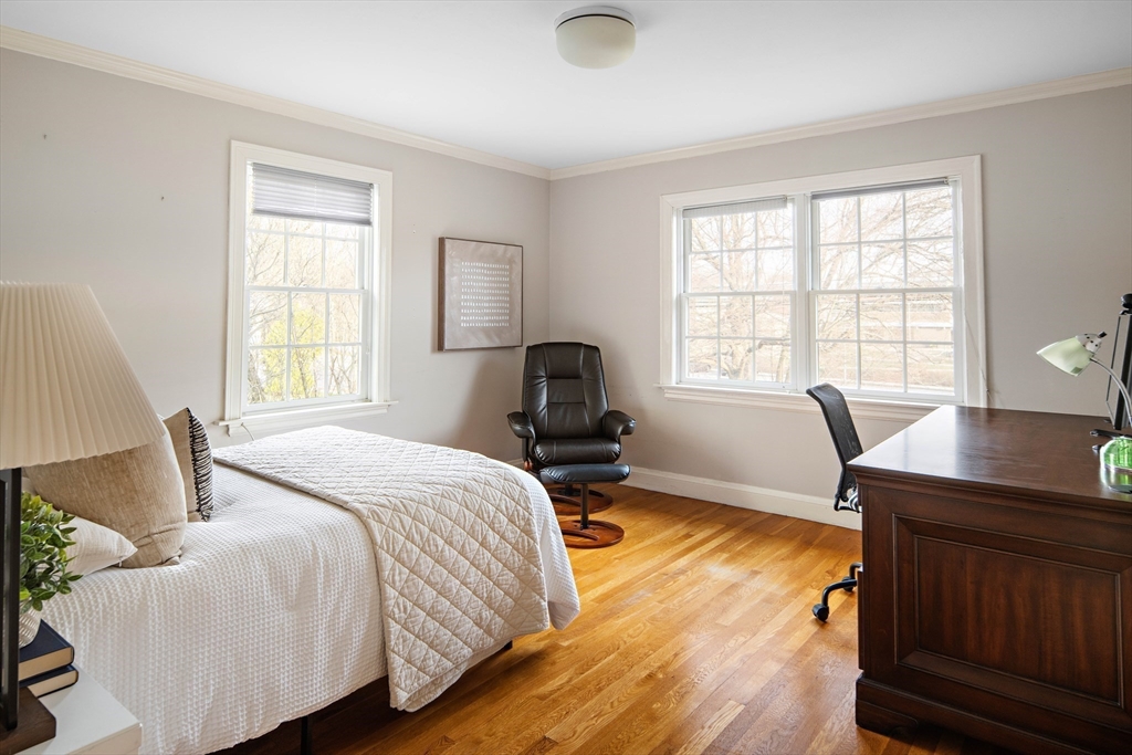 5 Evelyn Road Newton, MA 02468 - Photo 15 of 21 a bedroom with a bed and a desk