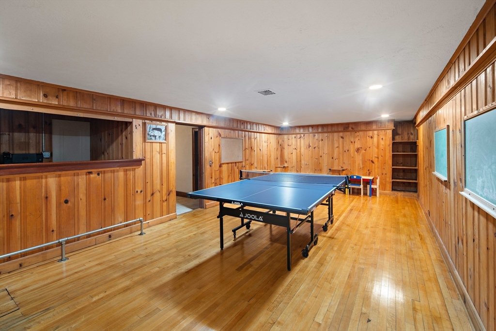 5 Evelyn Road Newton, MA 02468 - Photo 17 of 21 a living room with stainless steel appliances furniture and a wooden floor