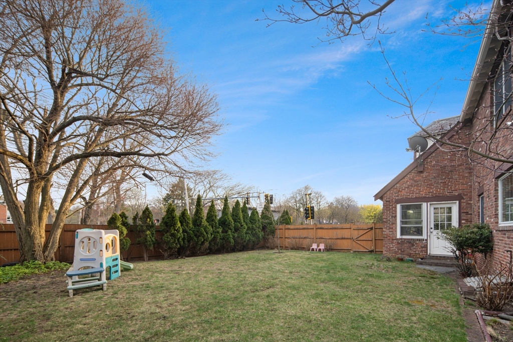 5 Evelyn Road Newton, MA 02468 - Photo 20 of 21 a front view of a house with a yard