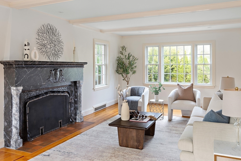 5 Evelyn Road Newton, MA 02468 - Photo 3 of 21 a living room with furniture a large window and a fireplace