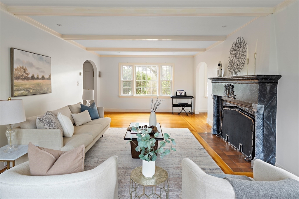 5 Evelyn Road Newton, MA 02468 - Photo 4 of 21 a living room with furniture a fireplace and a potted plant