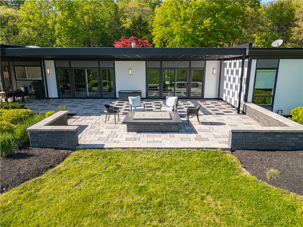 1506 Pleasant View Road Coopersburg, PA 18036 - Photo 79 of 97 A spacious stone patio with a built-in fire pit offers an ideal setting for outdoor entertaining.