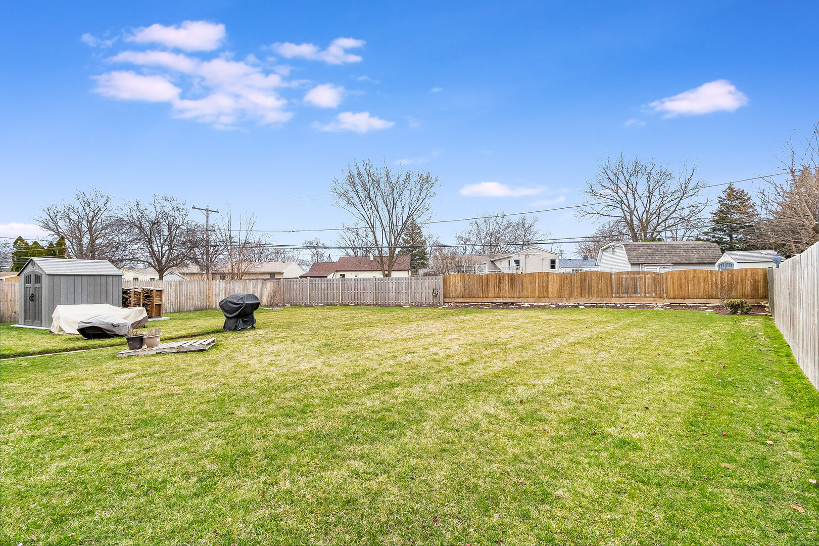 531 Glen Avenue Romeoville, IL 60446 - Photo 14 of 15 a view of a swimming pool with a yard and a large tree