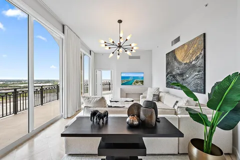 a view of a livingroom with furniture and a chandelier