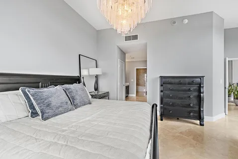 a bedroom with a bed and a dresser