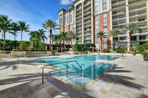 a view of a swimming pool and a patio