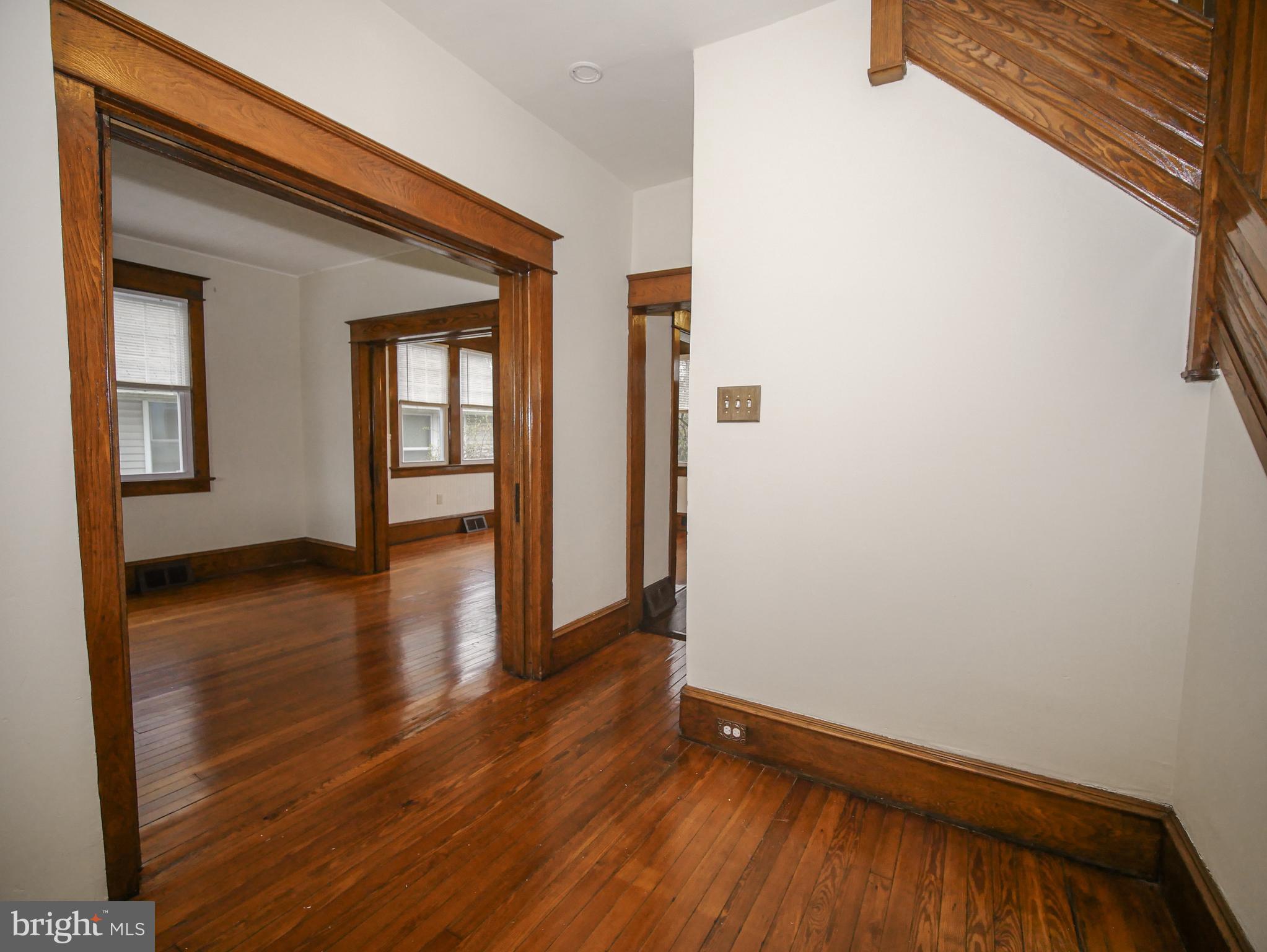 332 Crown Point Road Thorofare, NJ 08086 - Photo 9 of 36 a view of an empty room with wooden floor and a window
