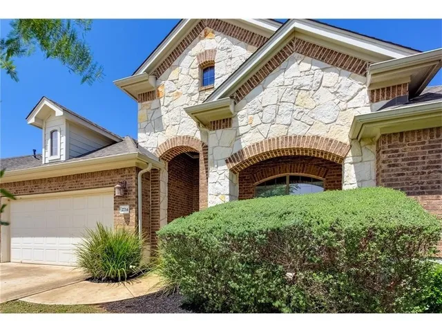a view of a house with a street
